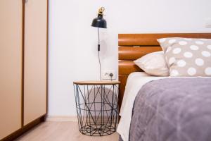 Posteľ alebo postele v izbe v ubytovaní Apartments Up&Up