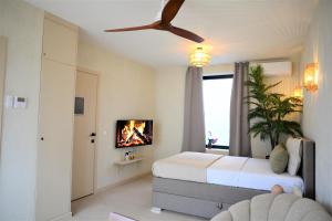 a bedroom with a bed and a ceiling fan at Kyoto Suites - Center Antwerp! in Antwerp