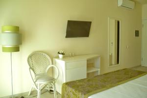 Postel nebo postele na pokoji v ubytování Ouril Hotel Julia