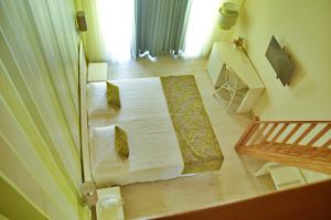 Postel nebo postele na pokoji v ubytování Ouril Hotel Julia
