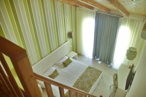 Postel nebo postele na pokoji v ubytování Ouril Hotel Julia