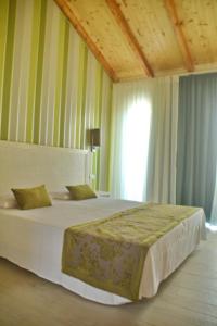 Postel nebo postele na pokoji v ubytování Ouril Hotel Julia