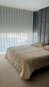 Cama ou camas em um quarto em Pé na Areia