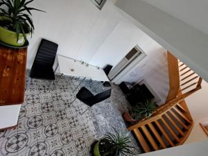 an overhead view of a room with plants and stairs at HostelHollabrunn in Hollabrunn