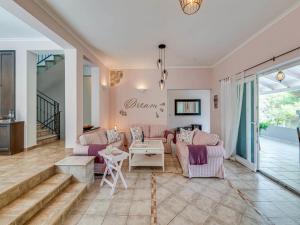 a living room with two couches and a table at Villa Angela in Lastovo