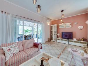 a living room with a couch and a tv at Villa Angela in Lastovo