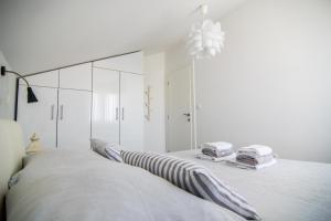 Posteľ alebo postele v izbe v ubytovaní Apartments Up&Up