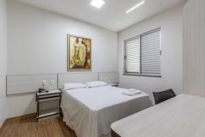 Postel nebo postele na pokoji v ubytování Hotel Lisbor