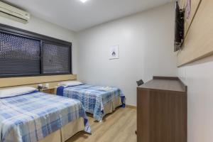 Postel nebo postele na pokoji v ubytování Hotel Lisbor