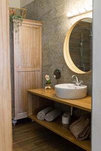 a bathroom with a sink and a mirror at Hotel Rural Ohana in Santa Cruz de Tenerife