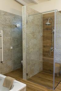 a shower with a glass door in a bathroom at Hotel Rural Ohana in Santa Cruz de Tenerife