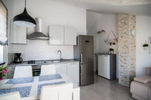 Kuchyňa alebo kuchynka v ubytovaní Apartments Up&Up
