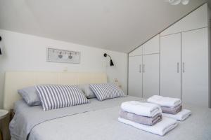 Posteľ alebo postele v izbe v ubytovaní Apartments Up&Up