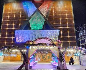 a christmas display of a building with lights at Gokul Raj By WB Economy , Madhubani in Madhubani