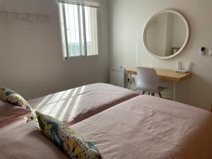 A bed or beds in a room at Stunning 3-Bed Apartment in Puerto De Mazarron