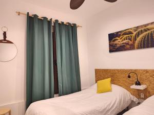 Posteľ alebo postele v izbe v ubytovaní La Casa de Pedro Verdugo Apartamento Turístico