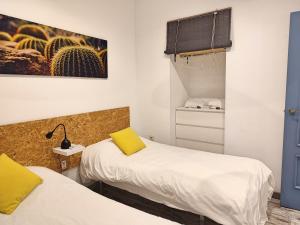 Posteľ alebo postele v izbe v ubytovaní La Casa de Pedro Verdugo Apartamento Turístico