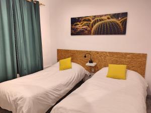 Posteľ alebo postele v izbe v ubytovaní La Casa de Pedro Verdugo Apartamento Turístico