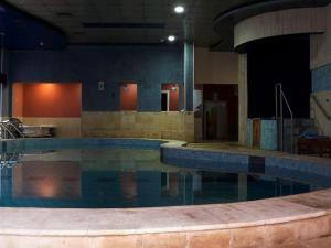 a large swimming pool in a building at Beauty Inn in Ramallah