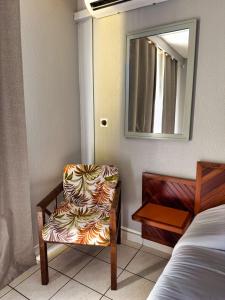 Ein Bett oder Betten in einem Zimmer der Unterkunft L'Hôtel Du Fleuve