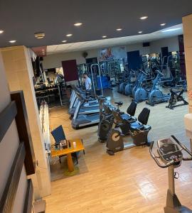 a gym with several treadmills and machines at Beauty Inn in Ramallah