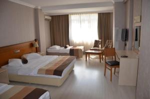 Postel nebo postele na pokoji v ubytování Green Mount Hotel