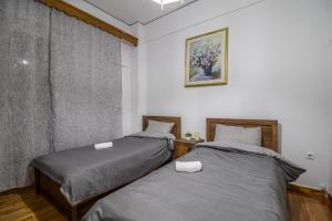 Postel nebo postele na pokoji v ubytování Studio Mélange in Loutraki DT