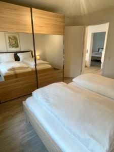 a hotel room with two beds at Landhaus Laugele Ferienwohnungen in Nußdorf