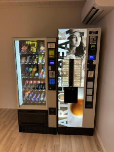 a vending machine is next to a wall at Camp Skytterhuset in Hammerfest