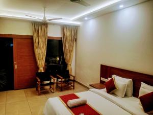 Pearlspot Hotel客房内的一张或多张床位