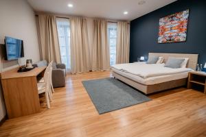 En eller flere senge i et værelse på Cukrownia