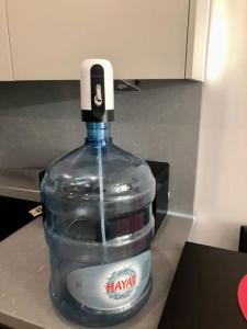 a bottle of water sitting on a counter at Secured Lux 1 + 1 apartment - Gym, Sauna & Parking ( EMP 142 ) in Esenyurt