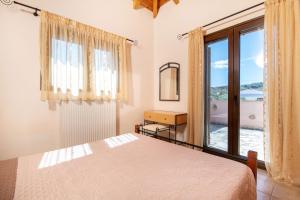 Postel nebo postele na pokoji v ubytování Olive Tree Villas