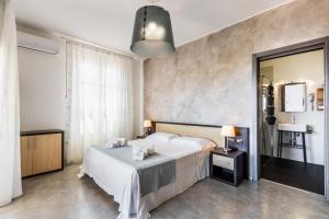 Postel nebo postele na pokoji v ubytování Marricriu Camere Avola + 29 fotografií