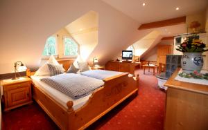 a bedroom with a wooden bed in a room at Rebstock Waldulm in Kappelrodeck