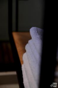 a stack of white towels sitting on a table at Kuća za odmor Rubić in Vinkovci