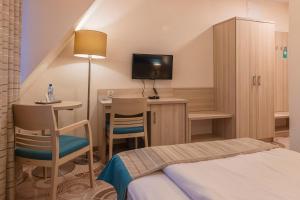 Posteľ alebo postele v izbe v ubytovaní Hotel Cesarskie Ogrody