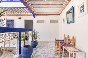 a living room with two chairs and a table at Riad Hôtel Essaouira in Marrakech