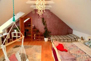 a room with a hammock in a attic at Komfortowy Dom w Chmurach in Dydnia