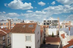 a view of a city with buildings at Oh Parisien - 10 min Paris Montparnasse in Vanves