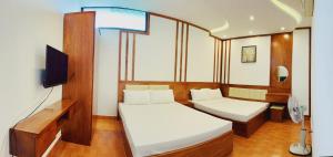 TV a/nebo společenská místnost v ubytování Đức Tuân 2 Motel + 8 fotografií