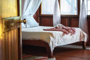 Ένα ή περισσότερα κρεβάτια σε δωμάτιο στο Ocean Forest Ecolodge