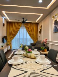 a living room with a table and a couch at Nabiha Suites Vista Bangi Bandar Baru Bangi in Bangi