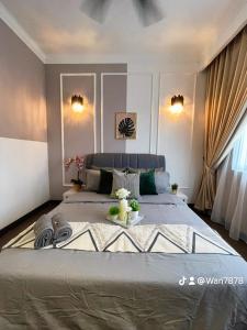 a bedroom with a large bed in a room at Nabiha Suites Bandar Baru Bangi in Bangi