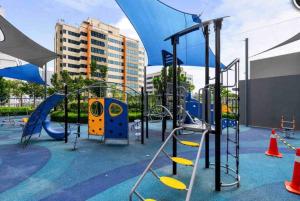 a playground with a slide and swings at Lumi Tropicana, PJ-02, Golf View in Petaling Jaya