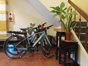 a bike parked in a room next to a staircase at The LEY HOTEL 寶麗頌旅館 in Tainan