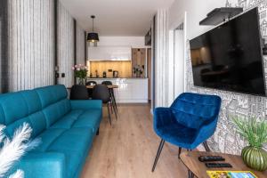 Televízia a/alebo spoločenská miestnosť v ubytovaní InPoint Drive Inn - Stay&Park Free