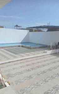 a swimming pool on top of a building at Departamento Playas Villamil vacaciones in Playas
