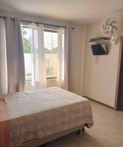 A bed or beds in a room at Departamento Playas Villamil vacaciones
