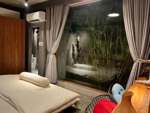 Ein Bett oder Betten in einem Zimmer der Unterkunft Cat Homestay